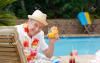 mature-man-drinking-a-cocktail-beside-the-swimming-pool.jpg